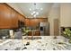 Spacious kitchen featuring granite countertops, stainless steel appliances, and ample cabinet space at 1914 Tweed Ln, Burlington, NC 27215