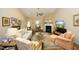 Bright living room features a fireplace, plush seating, and ample natural light, creating a cozy space for relaxation at 1914 Tweed Ln, Burlington, NC 27215