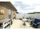 Enclosed patio with a white fence, outdoor seating, and well-maintained brickwork at 1914 Tweed Ln, Burlington, NC 27215