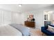 Comfortable bedroom with neutral tones, modern decor, and an ensuite bathroom at 1919 Plott Balsam Dr, Wendell, NC 27591