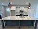 Open kitchen featuring a large island, pendant lighting, and stainless steel appliances at 1919 Plott Balsam Dr, Wendell, NC 27591