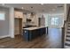 Open-concept living room featuring modern flooring and neutral paint colors at 1919 Plott Balsam Dr, Wendell, NC 27591