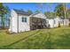 An ample backyard with a screened porch provides scenic views from this home at 271 Sacred Fire Rd, Louisburg, NC 27549