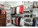 Organized walk-in closet with shelving and hanging rods at 271 Sacred Fire Rd, Louisburg, NC 27549
