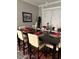 A dining room with dark wood table, seating for eight, and holiday decorations at 271 Sacred Fire Rd, Louisburg, NC 27549