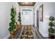 Inviting entryway features a stylish rug, wood-look floors, and a well-lit space at 271 Sacred Fire Rd, Louisburg, NC 27549