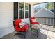 Cozy covered front porch with comfortable seating and charming decor at 271 Sacred Fire Rd, Louisburg, NC 27549
