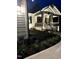 A charming two-story home with landscaped front yard and walkway at night at 271 Sacred Fire Rd, Louisburg, NC 27549
