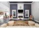 Comfortable living room features a modern fireplace and a view of the dining area at 271 Sacred Fire Rd, Louisburg, NC 27549