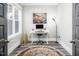 Bright office features a modern desk, ample natural light, and stylish decor at 271 Sacred Fire Rd, Louisburg, NC 27549