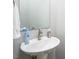 Cozy powder room with a pedestal sink and decorative accents at 271 Sacred Fire Rd, Louisburg, NC 27549