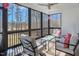 Open screened porch with comfortable seating and views of the surrounding nature at 271 Sacred Fire Rd, Louisburg, NC 27549