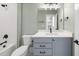 Elegant bathroom with mint green walls and white quartz vanity at 2829 Theresa Eileen Way, Raleigh, NC 27603
