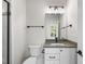 Modern bathroom featuring sleek fixtures, vanity with sink, and tiled shower at 2829 Theresa Eileen Way, Raleigh, NC 27603