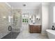 Modern bathroom featuring a glass-enclosed shower, soaking tub, and vanity at 2829 Theresa Eileen Way, Raleigh, NC 27603