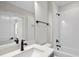 Modern bathroom features white tile, matte black fixtures, and a vanity sink at 2829 Theresa Eileen Way, Raleigh, NC 27603