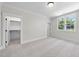 Bedroom featuring an open closet and natural light from the window at 2829 Theresa Eileen Way, Raleigh, NC 27603