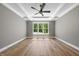 Cozy bedroom with trey ceiling, large window offering an outside view at 2829 Theresa Eileen Way, Raleigh, NC 27603