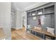 Entryway featuring mudroom style with wood floors and a bench with storage at 2829 Theresa Eileen Way, Raleigh, NC 27603