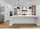 Kitchen featuring a large island with white countertop, and stainless steel appliances at 2829 Theresa Eileen Way, Raleigh, NC 27603