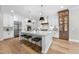 Gourmet kitchen with a large island, stainless appliances, and white shaker cabinets at 2829 Theresa Eileen Way, Raleigh, NC 27603