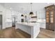 Spacious kitchen with a large island, stainless steel appliances, and hardwood floors at 2829 Theresa Eileen Way, Raleigh, NC 27603