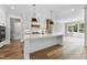 Spacious kitchen with a large island, stainless steel appliances, and hardwood floors at 2829 Theresa Eileen Way, Raleigh, NC 27603