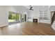 Spacious living room featuring built-in bookshelves, a fireplace, and sliding glass doors at 2829 Theresa Eileen Way, Raleigh, NC 27603