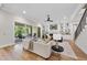 Inviting living room with fireplace, built-in shelving, and hardwood floors leading to an outdoor patio at 2829 Theresa Eileen Way, Raleigh, NC 27603