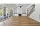 Living room with fireplace, custom built-ins, and sliding doors to outdoor living space at 2829 Theresa Eileen Way, Raleigh, NC 27603