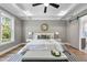 This main bedroom has a king bed, trey ceiling and access to an en suite bathroom and walk-in closet at 2829 Theresa Eileen Way, Raleigh, NC 27603