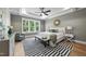 A main bedroom featuring trey ceilings, a ceiling fan, and large windows overlooking the backyard at 2829 Theresa Eileen Way, Raleigh, NC 27603