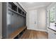 Well-organized mudroom with cubbies, coat hooks, and hardwood floors at 2829 Theresa Eileen Way, Raleigh, NC 27603