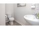 Cozy powder room featuring a pedestal sink, modern fixtures, and wood-look flooring at 2832 Egert Dr, Haw River, NC 27258