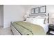 Comfortable bedroom featuring a plush bed, side tables, and decorative artwork at 2832 Egert Dr, Haw River, NC 27258