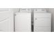 A modern laundry room featuring a front load washer and dryer at 2832 Egert Dr, Haw River, NC 27258