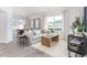 Bright living room featuring hardwood floors, large windows, and modern decor throughout at 2832 Egert Dr, Haw River, NC 27258