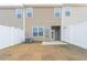 A backyard featuring a fenced-in lawn with a patio and access to the home's exterior entrance at 2834 Egert Dr, Haw River, NC 27258
