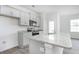 Open-concept kitchen with gray cabinets, granite countertops, and stainless steel appliances at 2834 Egert Dr, Haw River, NC 27258