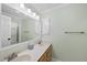 Bathroom boasts dual sinks, a large mirror, and light green painted walls at 3001 Hunters Bluff Dr, Raleigh, NC 27606