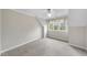 Cozy bedroom featuring neutral walls and carpet with a bright window view at 3001 Hunters Bluff Dr, Raleigh, NC 27606