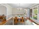 Cozy dining area featuring hardwood floors, wainscoting, and natural light at 3001 Hunters Bluff Dr, Raleigh, NC 27606