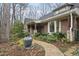 Inviting front yard with lush landscaping, stone walkway, and decorative water feature at 3001 Hunters Bluff Dr, Raleigh, NC 27606