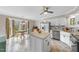 Bright kitchen with island, stainless steel appliances, and adjacent breakfast nook at 3001 Hunters Bluff Dr, Raleigh, NC 27606