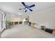 Bright living room features a ceiling fan and built in cabinets at 3001 Hunters Bluff Dr, Raleigh, NC 27606