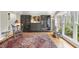Bright living room with hardwood floors, large window, and decorative rug at 3001 Hunters Bluff Dr, Raleigh, NC 27606