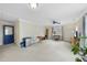 Bright living room features a blue ceiling fan and a view to the home exterior at 3001 Hunters Bluff Dr, Raleigh, NC 27606