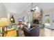 Open living room with stone fireplace, hardwood floors, and access to outdoor space at 3001 Hunters Bluff Dr, Raleigh, NC 27606