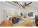 Spacious living room with vaulted ceiling, hardwood floors, and second-story balcony at 3001 Hunters Bluff Dr, Raleigh, NC 27606