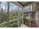 Screened porch offers a relaxing view of the wooded backyard at 3001 Hunters Bluff Dr, Raleigh, NC 27606